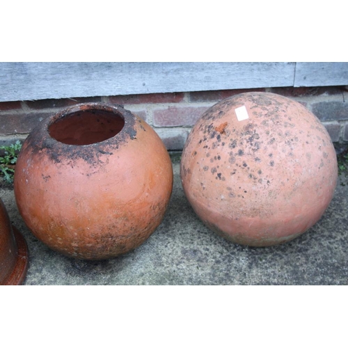 633 - A spherical terracotta planter, 13