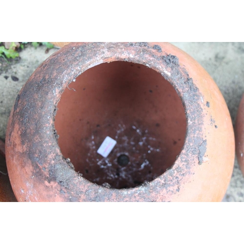 633 - A spherical terracotta planter, 13