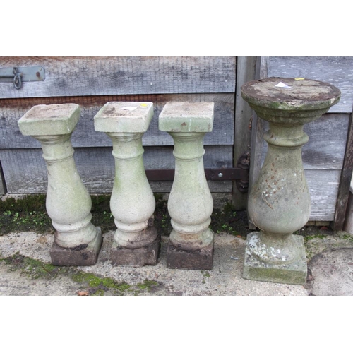 636 - Three cast stone turned columns, on square bases, 18 3/4