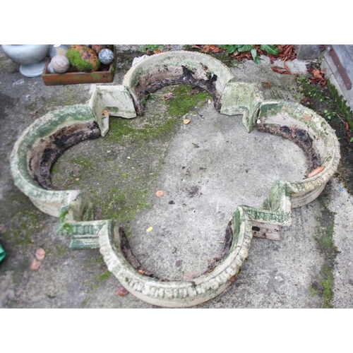 645 - A cast stone quatrefoil-shaped planter, 54