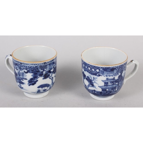 85 - Two Chinese blue and white coffee cups, decorated buildings in a landscape (hairline crack to one) C... 