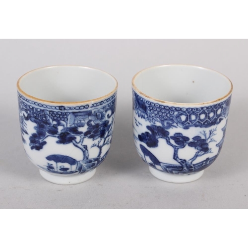 85 - Two Chinese blue and white coffee cups, decorated buildings in a landscape (hairline crack to one) C... 