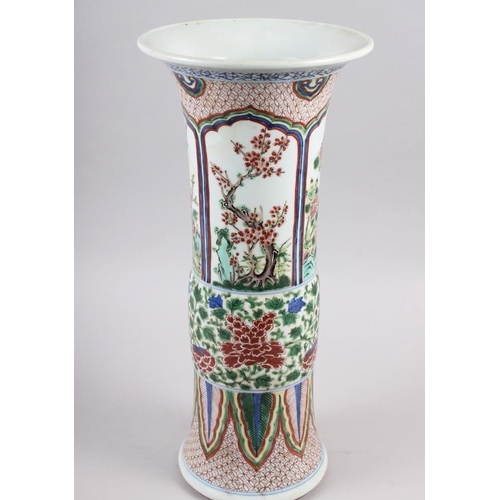 90 - A Chinese gu vase with panels decorated trees and flowers, 16 1/2