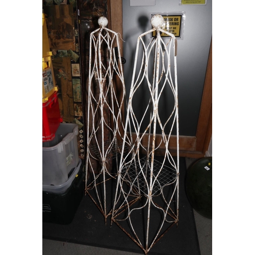 646 - A pair of white painted garden obelisks, 53