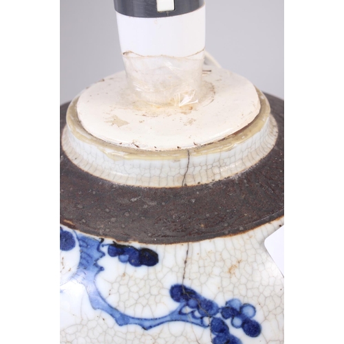 98 - A Chinese blue and white porcelain ginger jar, now converted to a table lamp, a similar cylinder vas... 