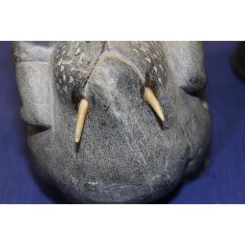 198 - An Inuit hardstone model of a man on a walrus, 8