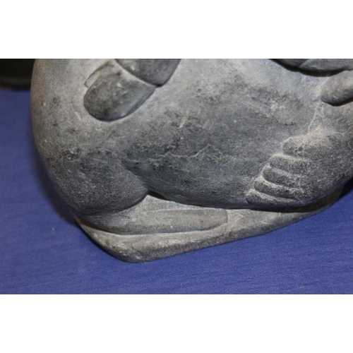 198 - An Inuit hardstone model of a man on a walrus, 8