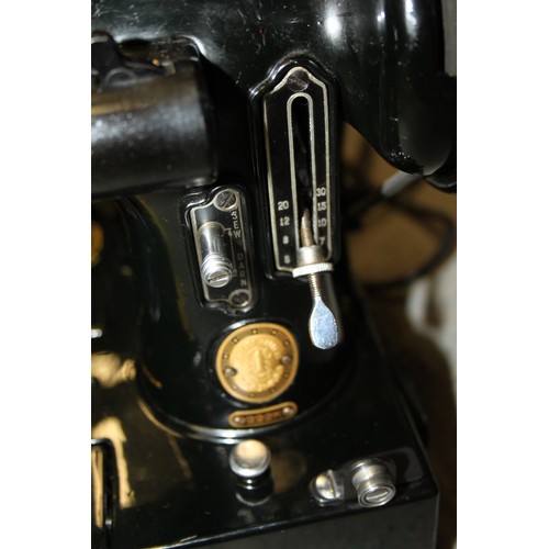 112 - A Singer electric sewing machine, Model 222K, Serial No EL683476, in fitted case with accessories, a... 