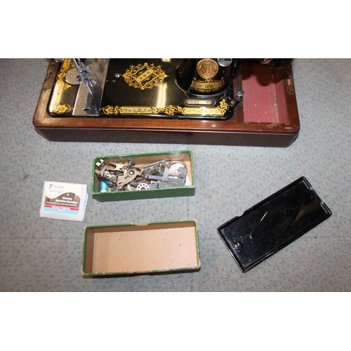 112 - A Singer electric sewing machine, Model 222K, Serial No EL683476, in fitted case with accessories, a... 