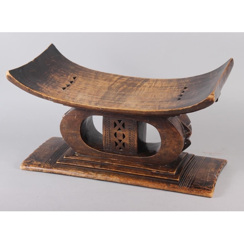 138 - An Ashanti carved hardwood stool, 21