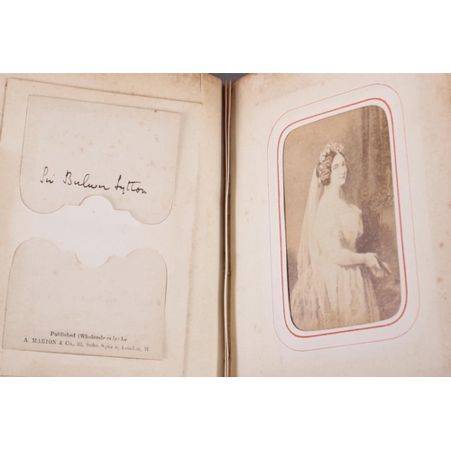 196 - A Victorian carte de visite album, containing approximately thirty photographs of nobility, etc