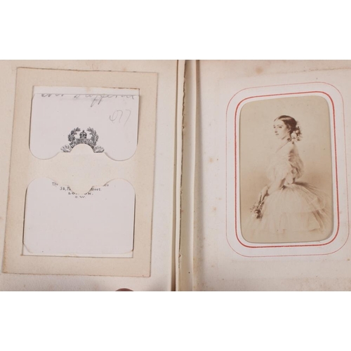 196 - A Victorian carte de visite album, containing approximately thirty photographs of nobility, etc