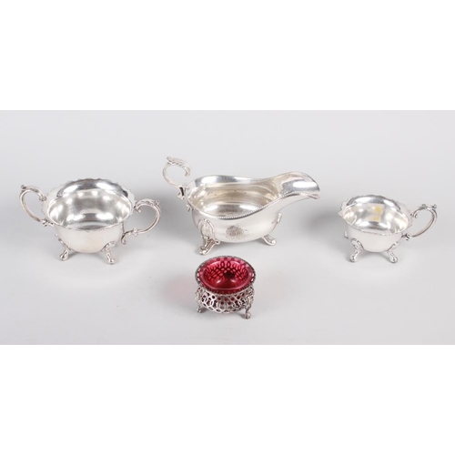 270 - A silver plated sauce boat, milk jug and sugar bowl, and a lattice work salt
COLLECT