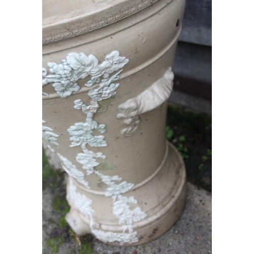 587 - A ceramic water purifier with relief decoration (damages), and a moulded glass carboy, 20 1/2