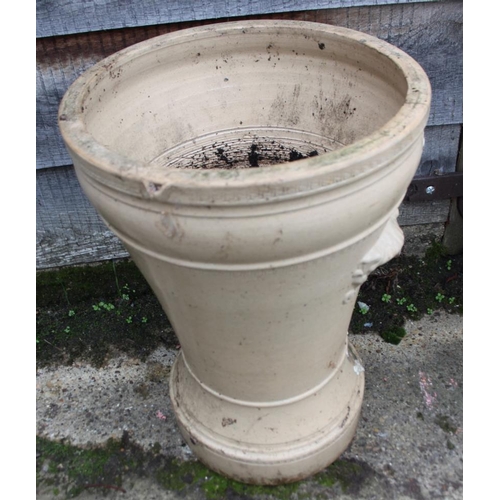 587 - A ceramic water purifier with relief decoration (damages), and a moulded glass carboy, 20 1/2