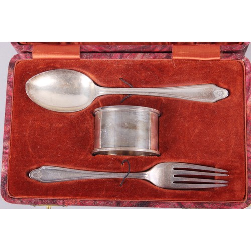 284 - A silver three-piece christening set, a silver napkin ring and a silver infant spoon, in fitted case... 