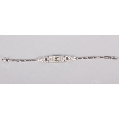 291 - A white metal and diamond set cocktail watch with silvered dial and Arabic numerals, inside of case ... 