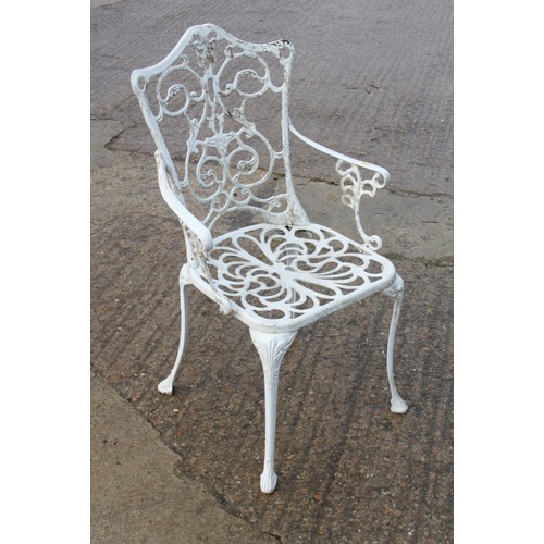 590 - A white painted aluminium circular openwork garden table and a set of four similar armchairs