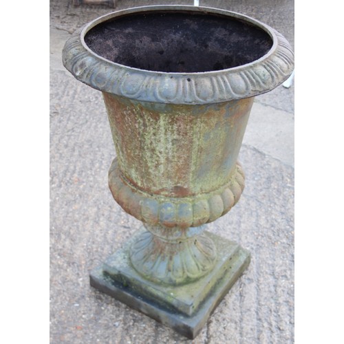 596 - A cast iron campana urn, 22