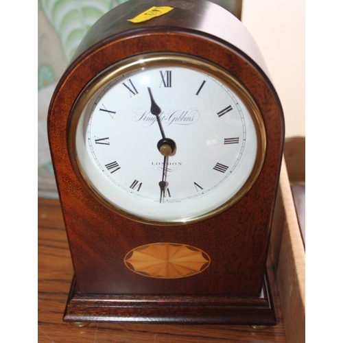 110 - A mahogany and inlaid cased mantel clock by Knight & Gibbons, 8