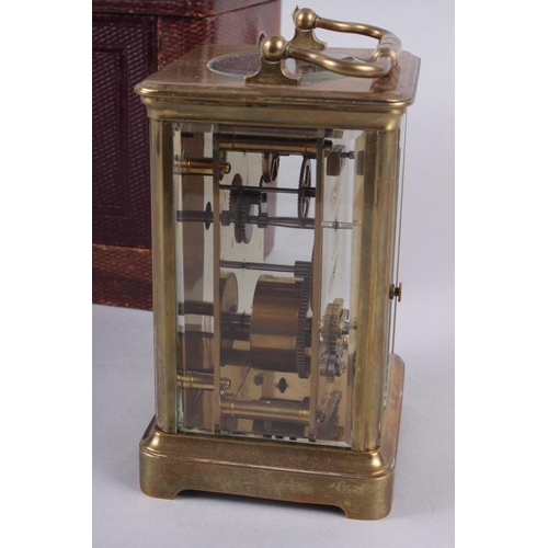 113 - A French five-glass carriage clock with white enamel dial and Roman numerals, retailed by Howell & J... 