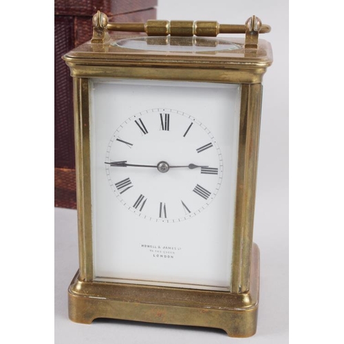 113 - A French five-glass carriage clock with white enamel dial and Roman numerals, retailed by Howell & J... 