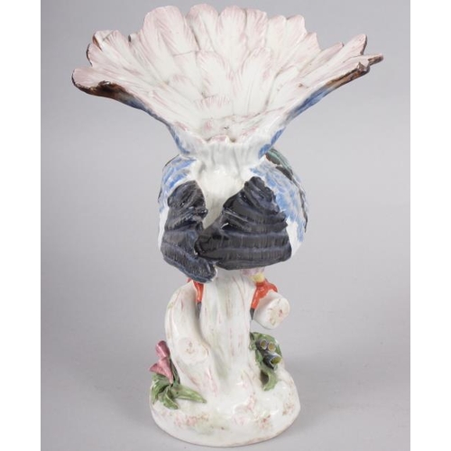 12 - A Continental porcelain model of an exotic bird, 9 1/2