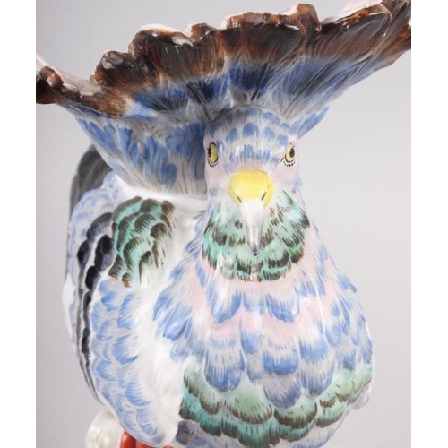 12 - A Continental porcelain model of an exotic bird, 9 1/2