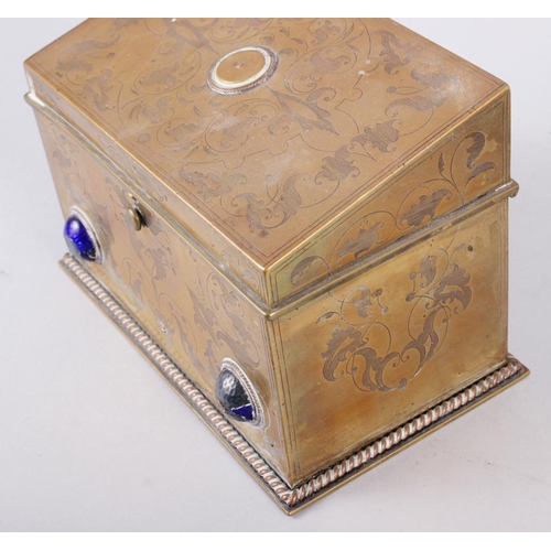 120 - A brass jewellery box with etched decoration and inset enamelled cabochons, 4 1/2