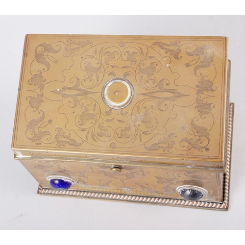 120 - A brass jewellery box with etched decoration and inset enamelled cabochons, 4 1/2