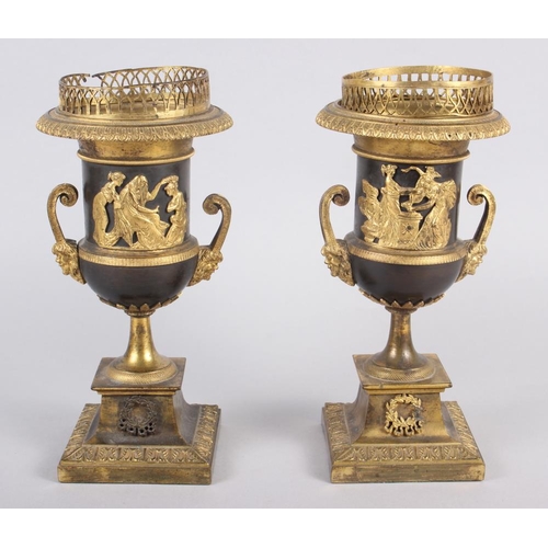 125 - A pair of Regency gilt bronze campana urns with relief figure decoration and satyr mask handles 8 1/... 