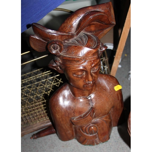 126 - A copper kettle, a saucepan and cover, a magazine rack and an Indonesian carved figure