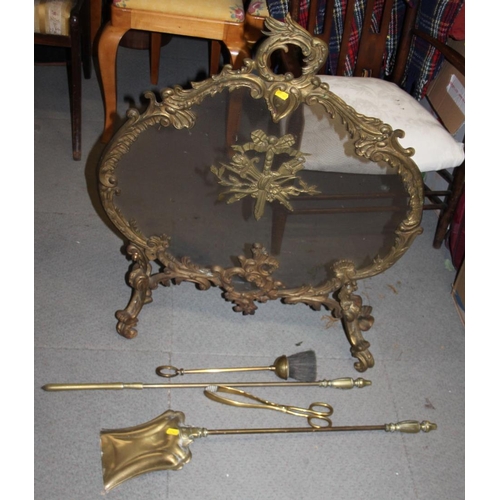 131 - A Rococo brass and mesh firescreen, 31