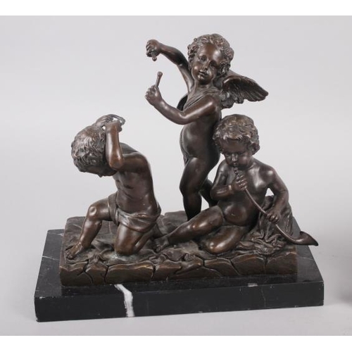 132 - Juan Clara: a bronzed figure group of three children sitting, 7