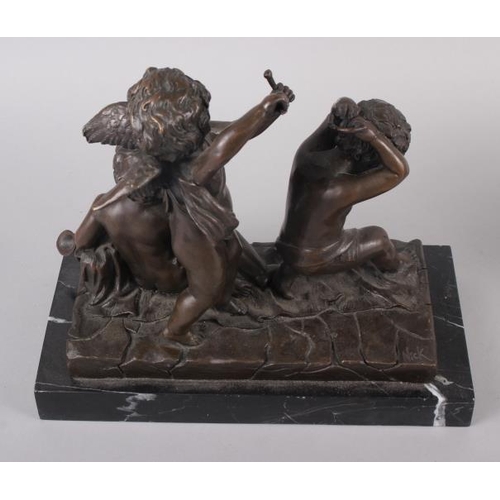 132 - Juan Clara: a bronzed figure group of three children sitting, 7