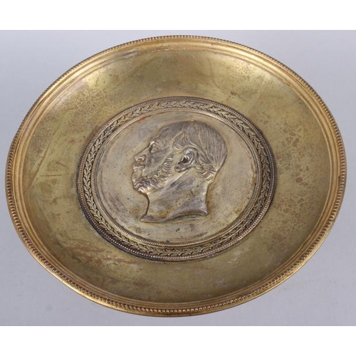 136 - A gilt brass tazza with silvered portrait medallion of an unknown prince