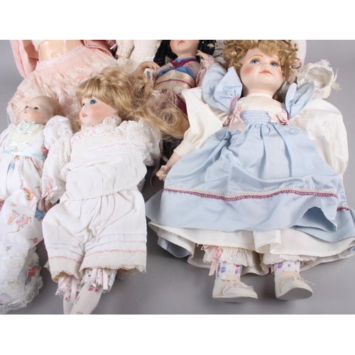 155 - Seven dolls, including a limited edition Hamilton Collection porcelain head doll, 