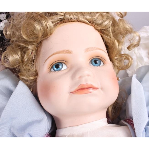 155 - Seven dolls, including a limited edition Hamilton Collection porcelain head doll, 