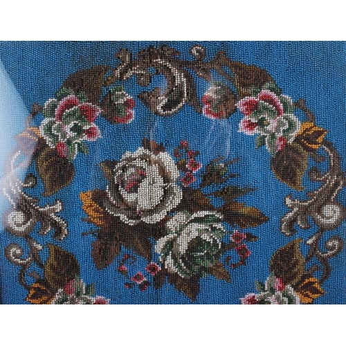 163 - A mid Victorian beadwork panel with floral decoration, 15