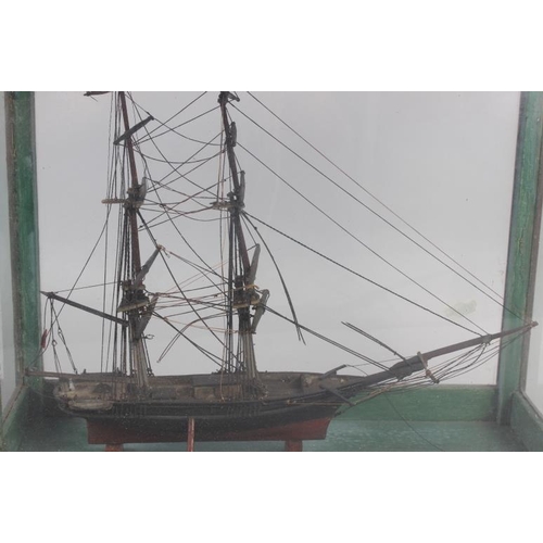 180 - An early 19th century model of a two-mast square-rigger, in an oak and four-glass case, 12 1/2