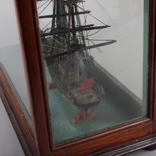 180 - An early 19th century model of a two-mast square-rigger, in an oak and four-glass case, 12 1/2