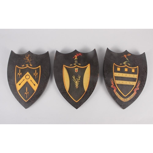 182 - Three ebonised plaques with coat of arms decoration, 8