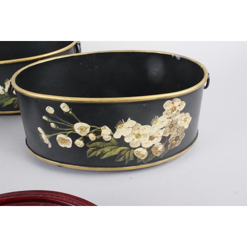 183 - A pair of toleware oval planters with floral decoration, gilt rims and ring handles, 3 1/2