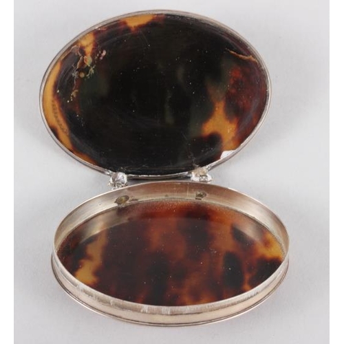 277 - An 18th century white metal and tortoiseshell oval snuffbox with pique decorated lid