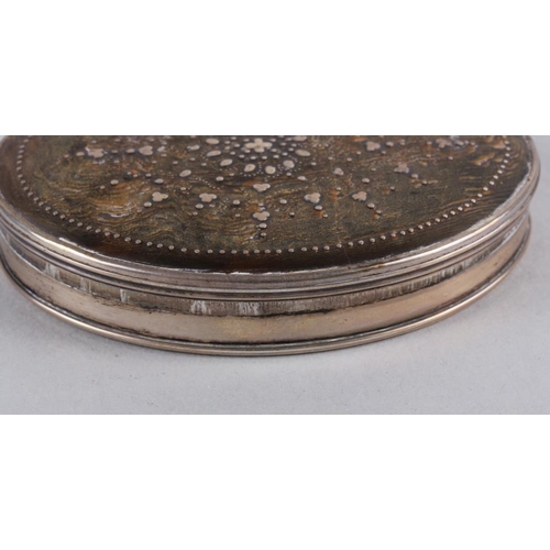 277 - An 18th century white metal and tortoiseshell oval snuffbox with pique decorated lid