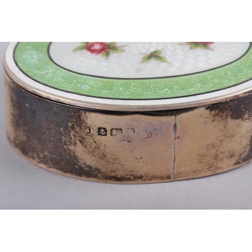 279 - A silver and guilloche enamel oval trinket box, decorated flowers, 2 3/8