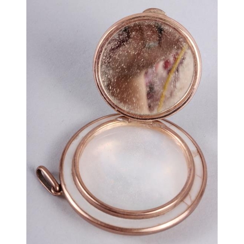 280 - A mother-of-pearl circular pendant compact with yellow metal mounts, stamped 9ct, 2