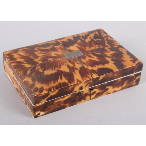 285 - A 19th century tortoiseshell box, containing a part set of Continental white metal sewing accessorie... 