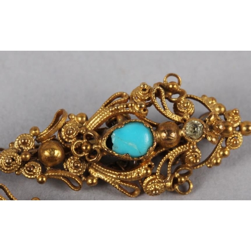 298 - A 19th century gilt metal scarf pin, set turquoise cabochons and aqua coloured stones, interlinked w... 