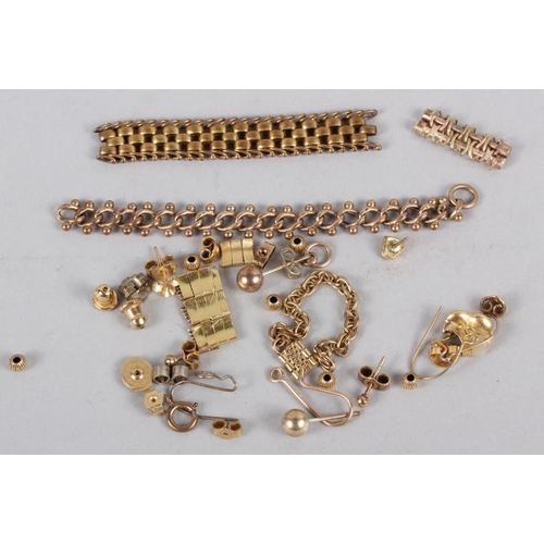 304 - A selection of yellow metal jewellery fragments, earring backs, etc, and a yellow metal tooth crown